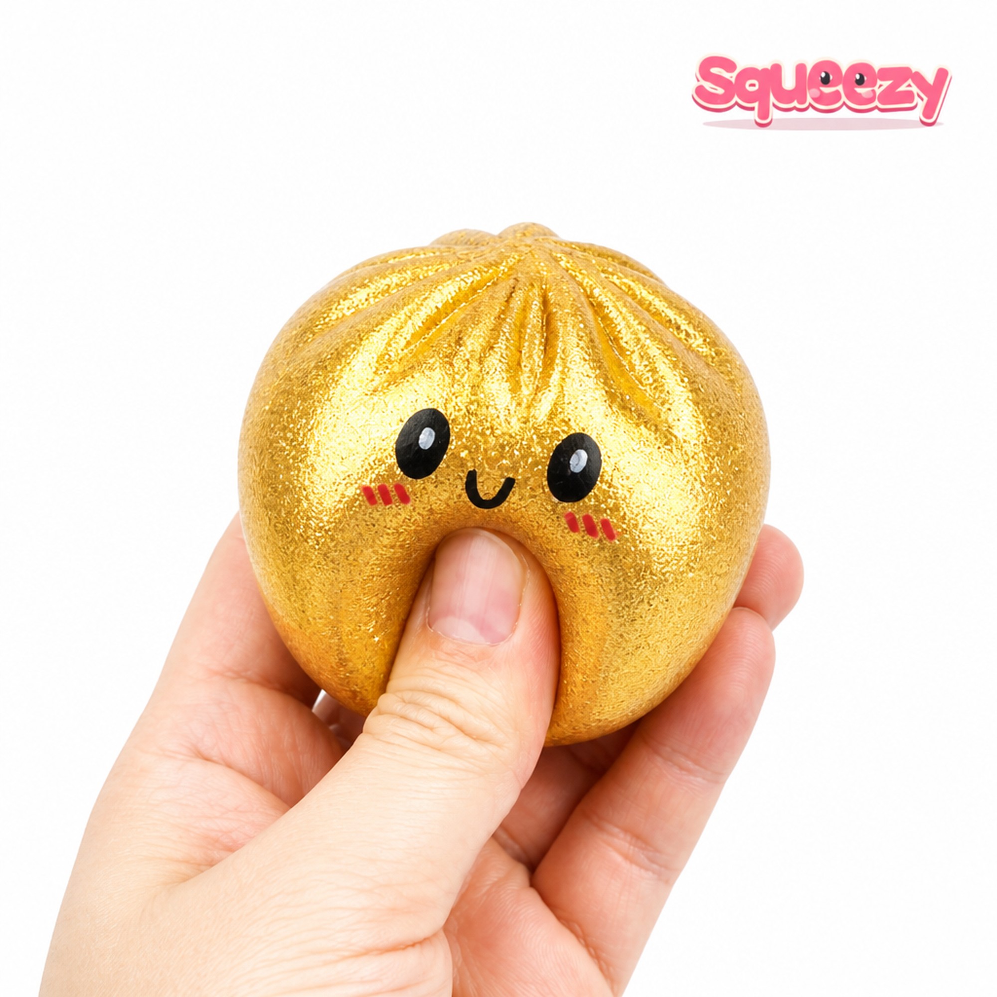Gold Face Bao being squeezed