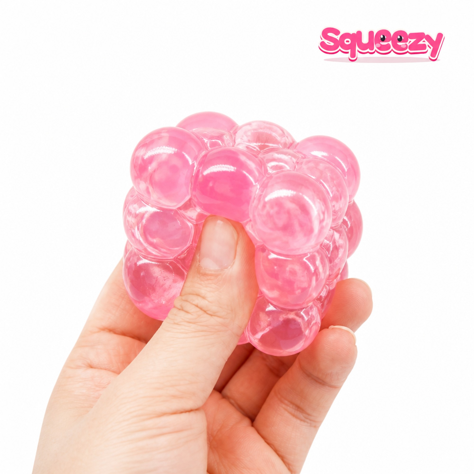 Pink Bubble Cube being squeezed