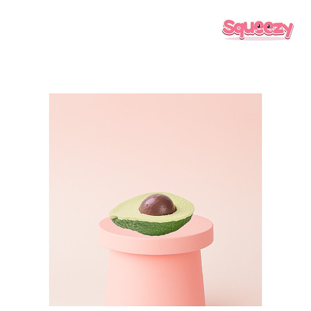 Avocado being squeezed