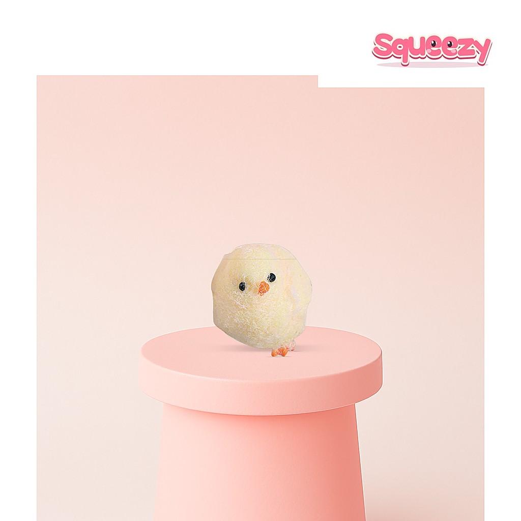 Chick Squishy being squeezed