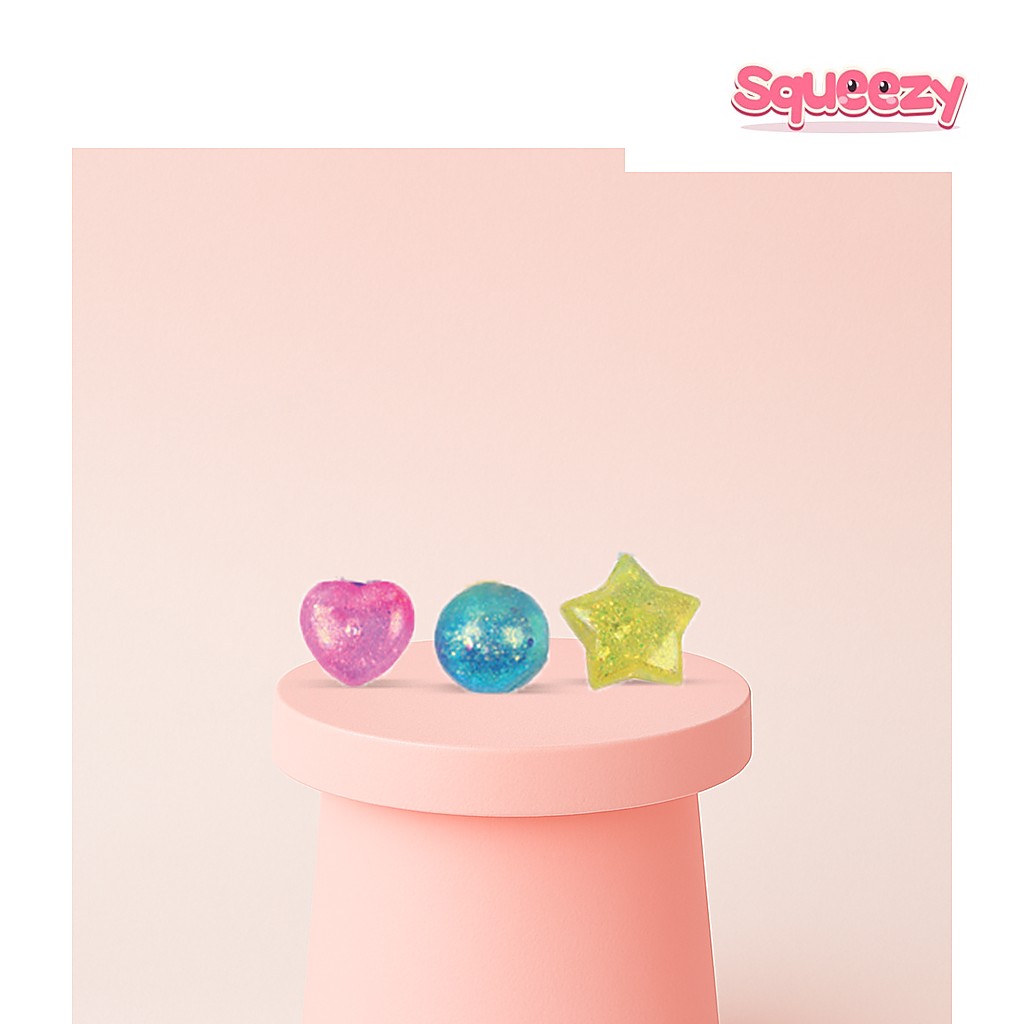 Maltose Squishies Mini Glitter Gem being squeezed