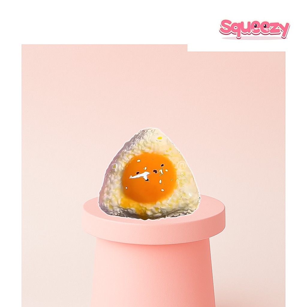 Cute Egg Rice Ball Squishy Toy being squeezed