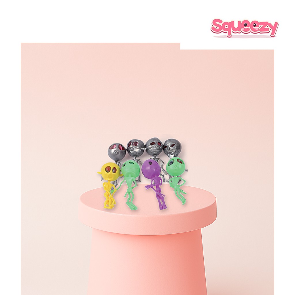 Squishy Alien being squeezed