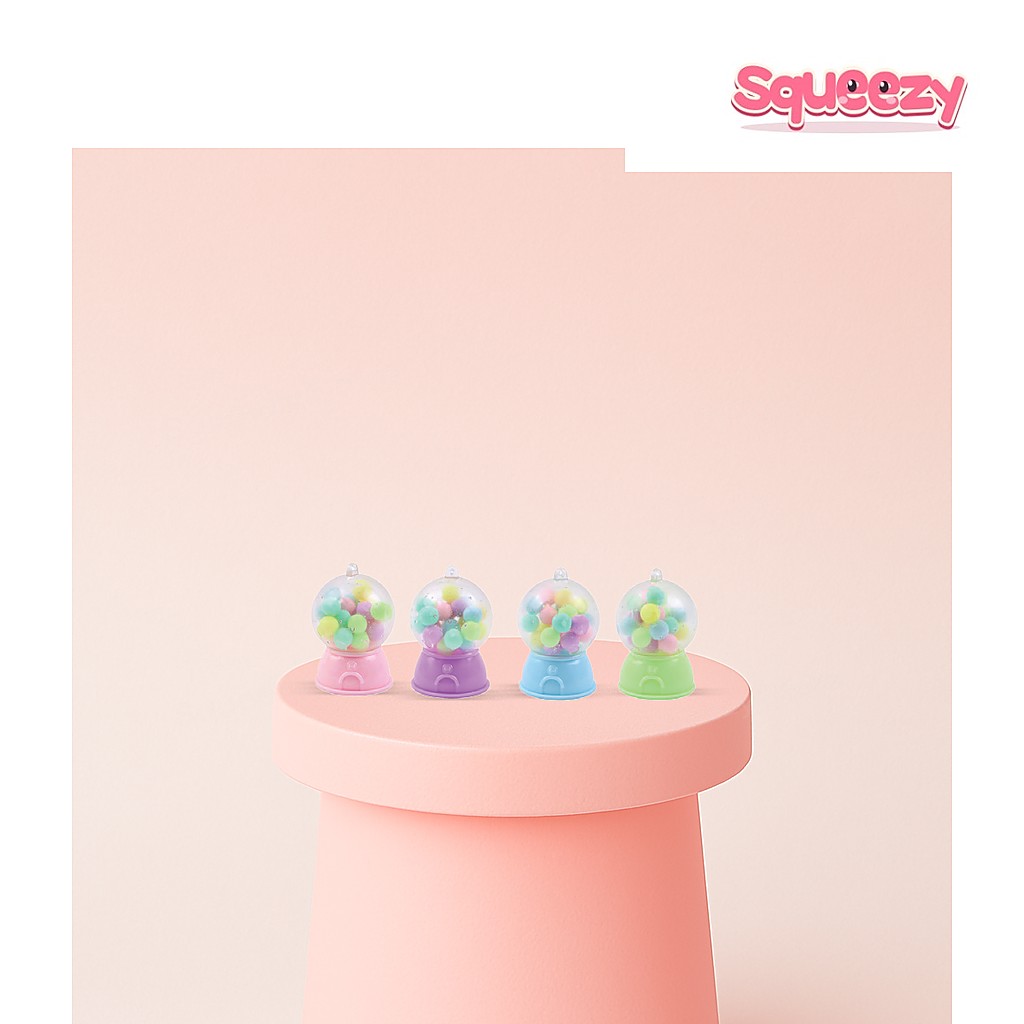 Squishy Capsule Machine Mini Gumball Machine being squeezed
