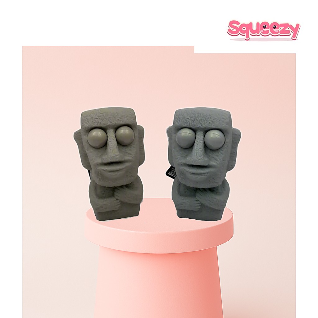 Stone Moai Pop Eye being squeezed