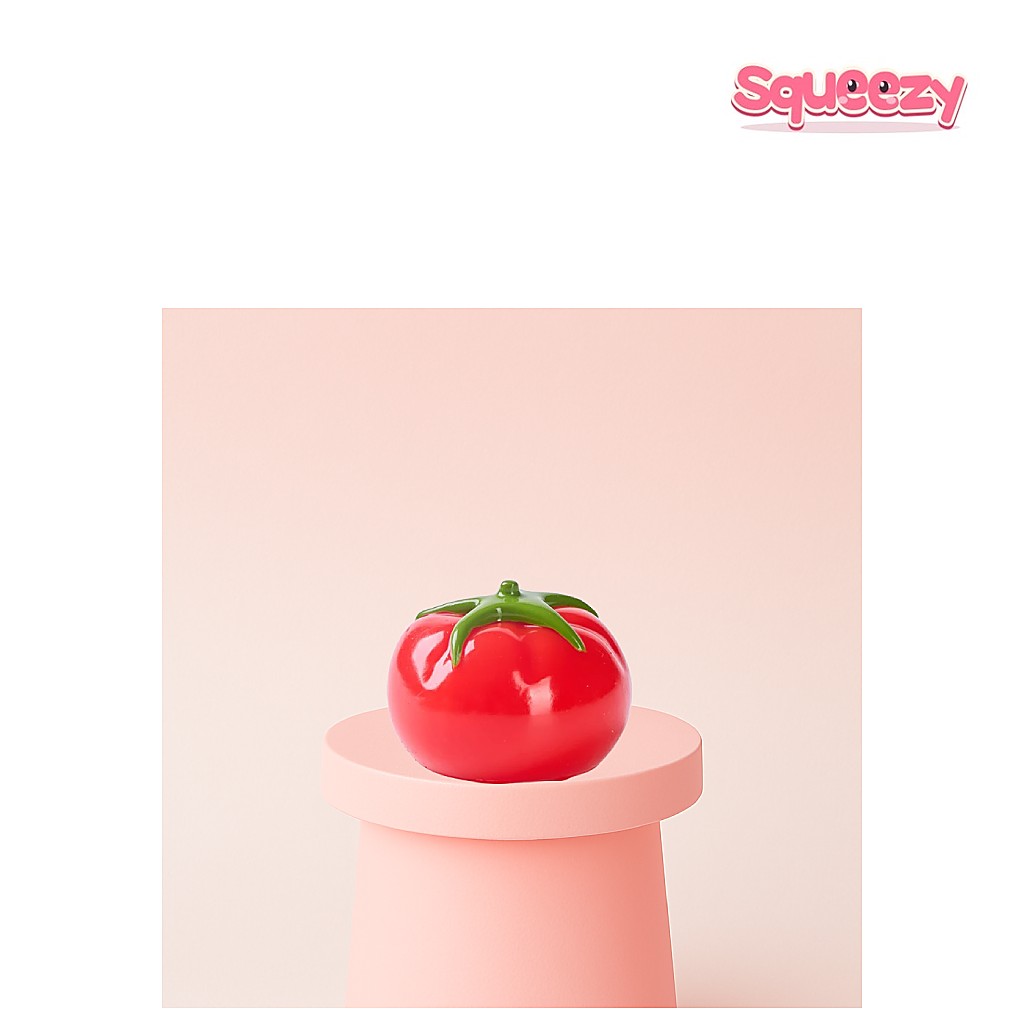 Tomato Squishy being squeezed
