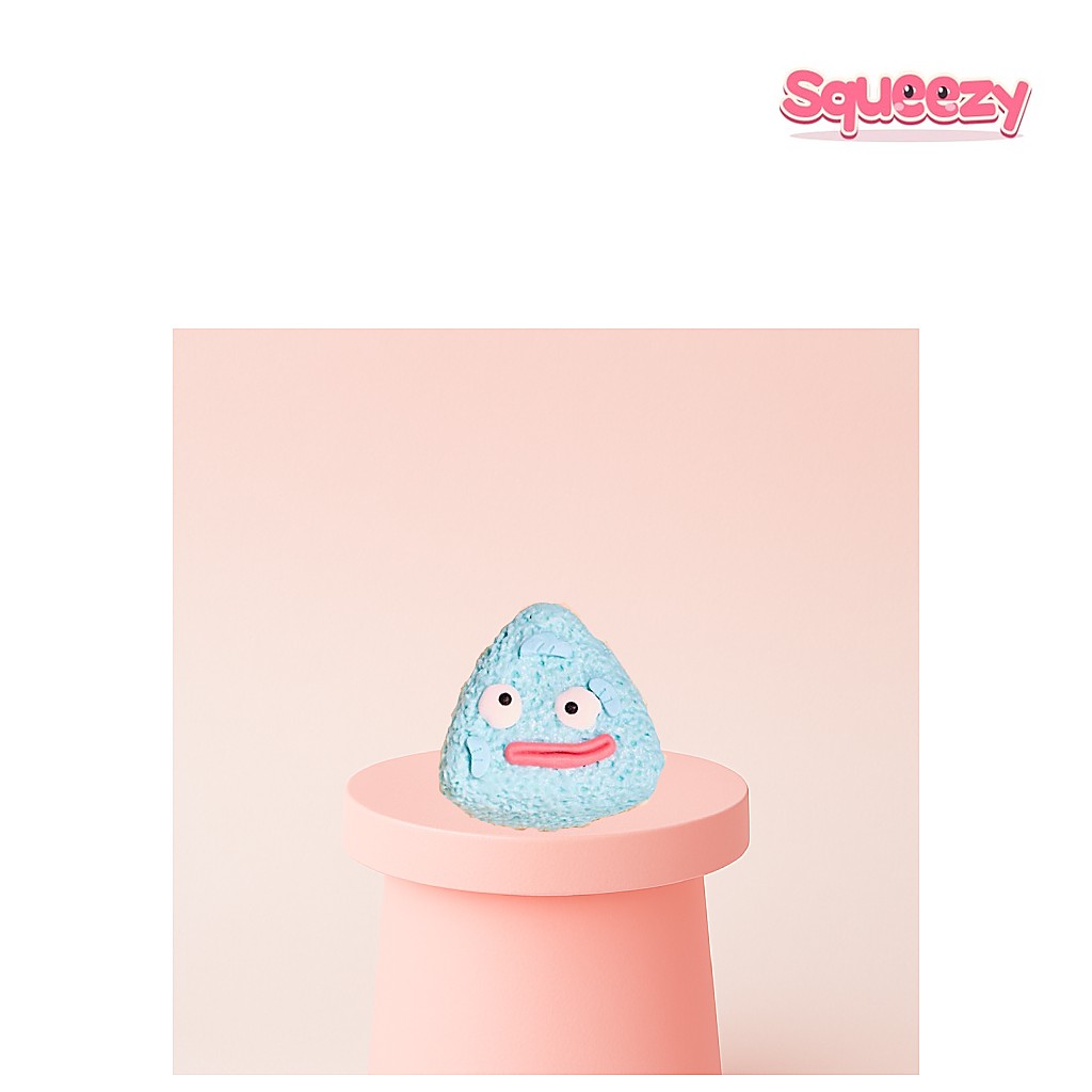Triangle Face Squishy being squeezed